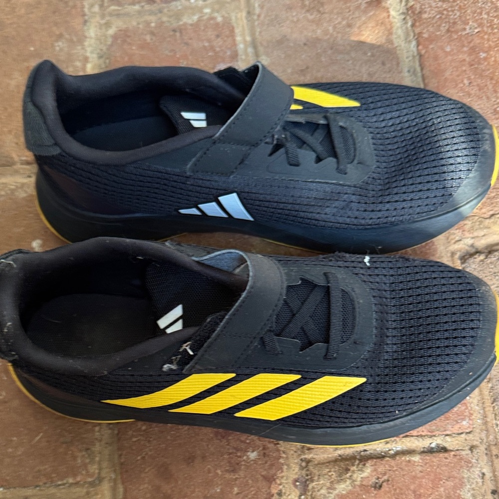 Adidas Black Sneakers with Yellow Stripes